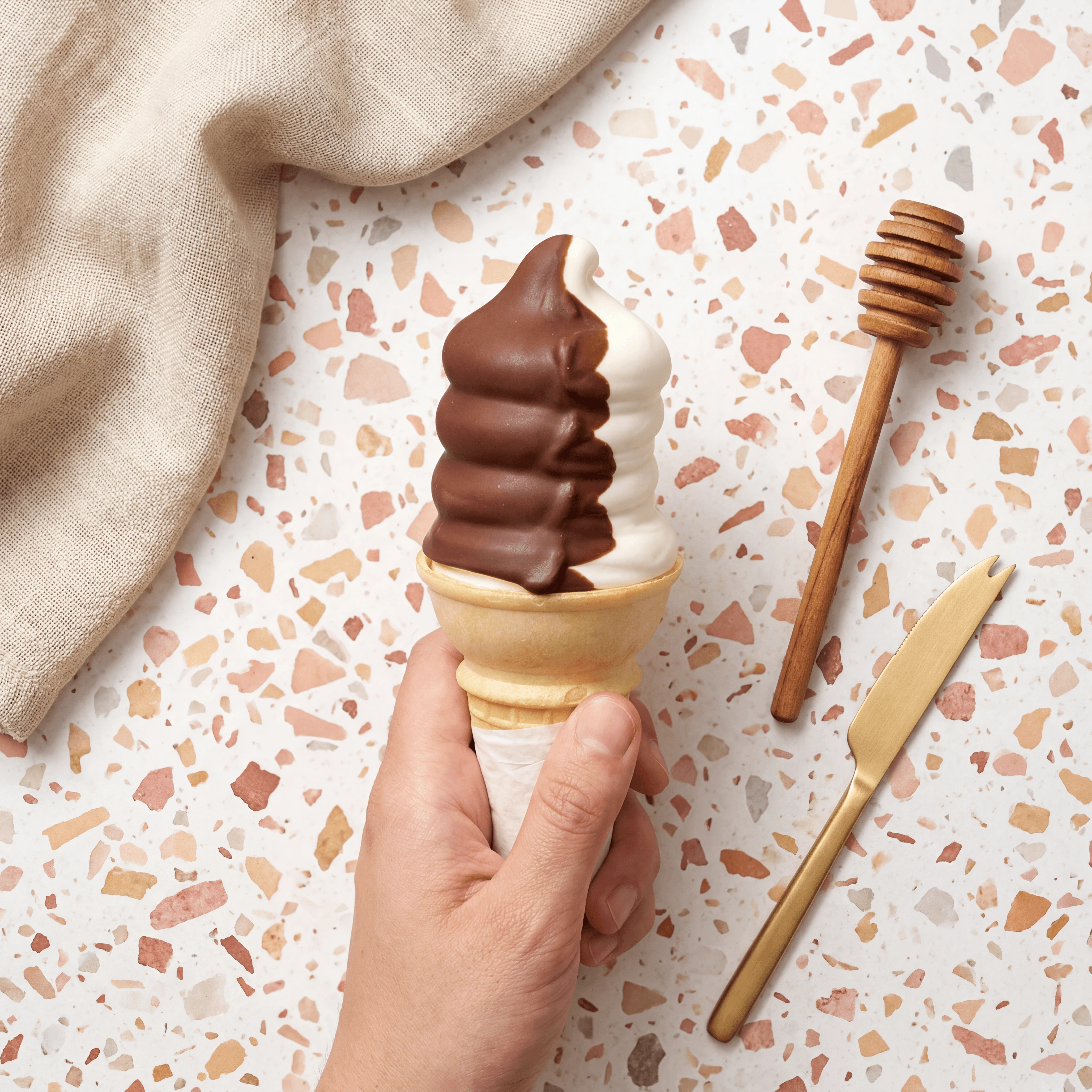 Vanilla soft-serve chocolate dip cone tall swirl — soft-serve scoop shop card photography
