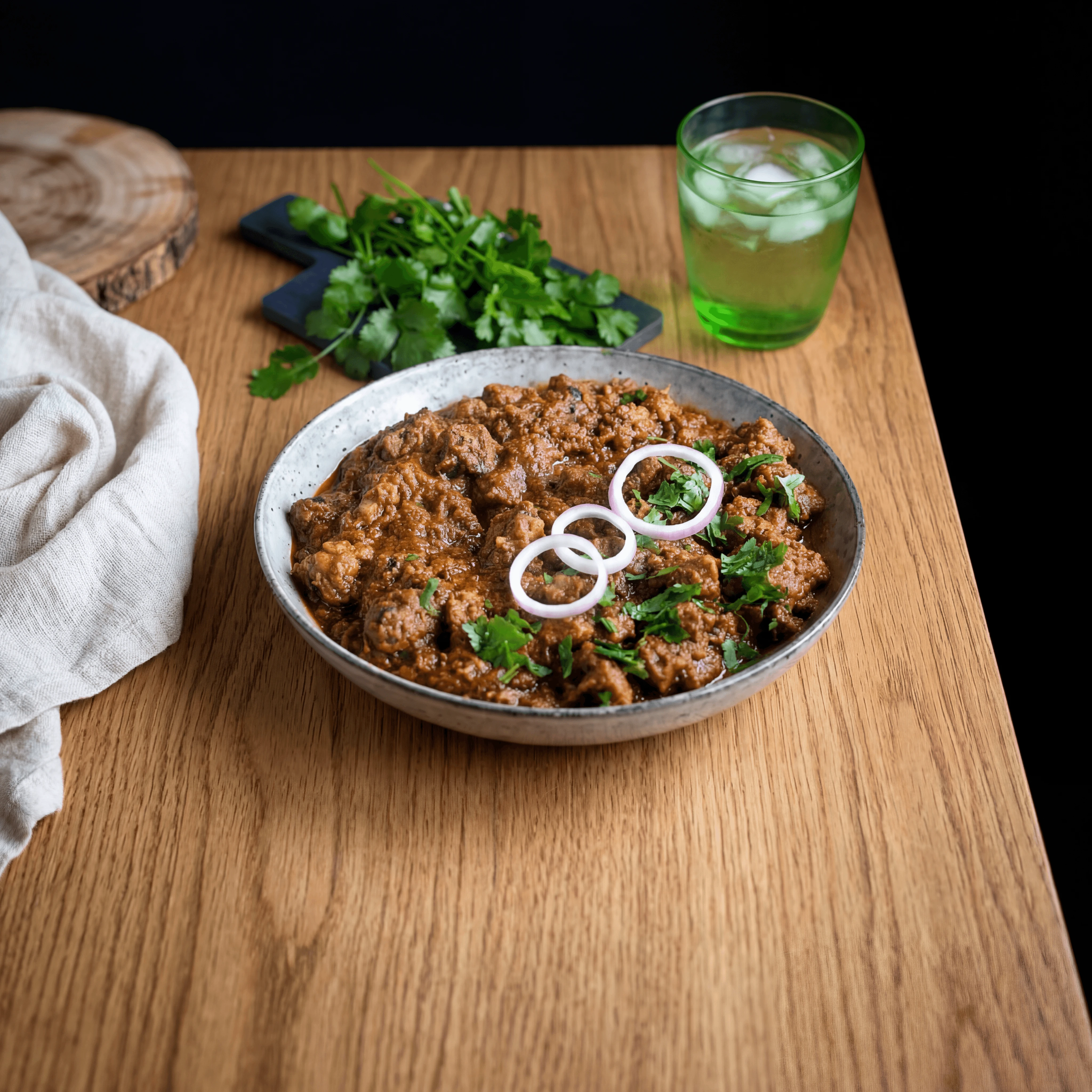 Kashmiri rogan josh deep red lamb curry macro bowl coriander — rogan josh FAQ sidebar photography