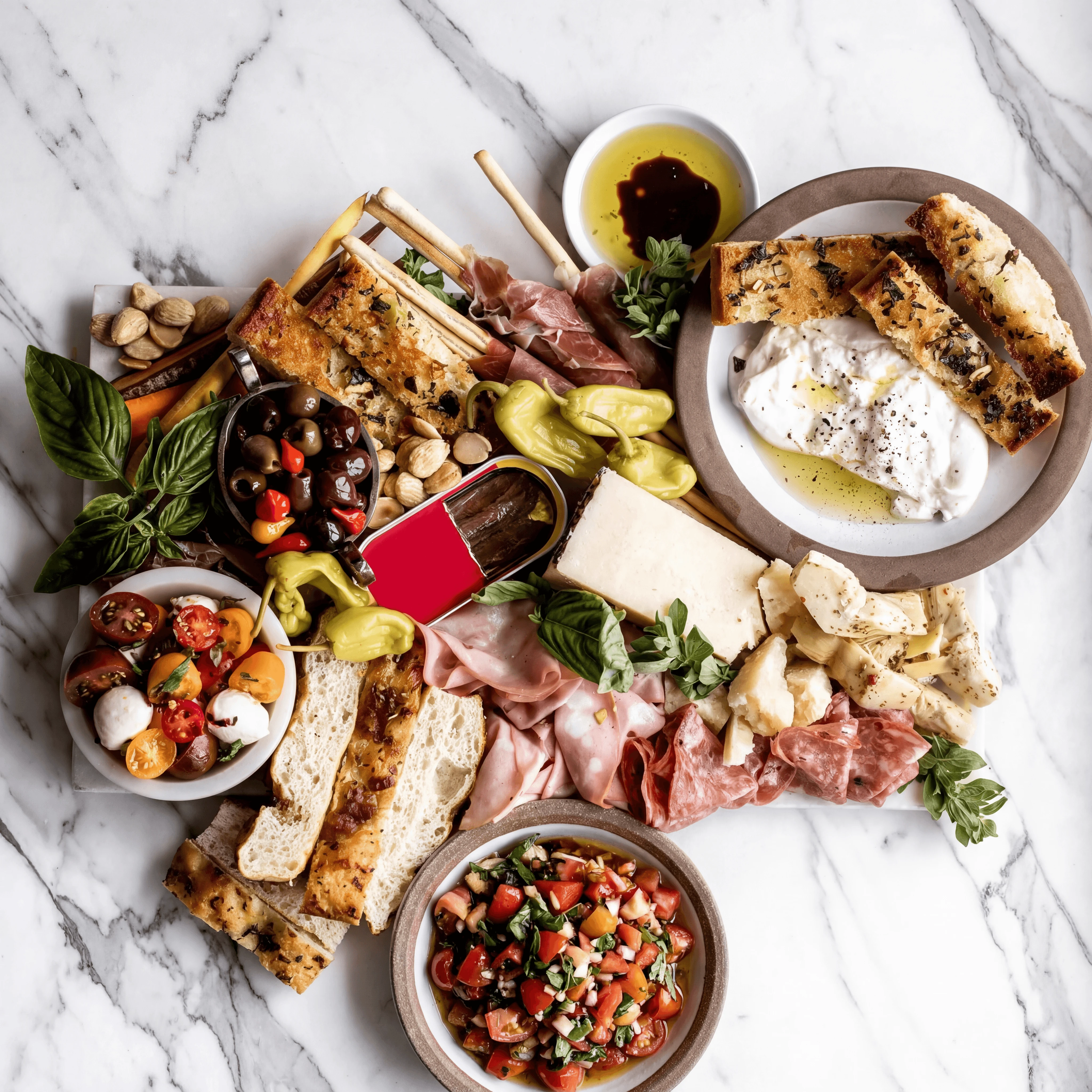 Antipasti salumi board prosciutto burrata mortadella overhead marble — antipasti hero photography