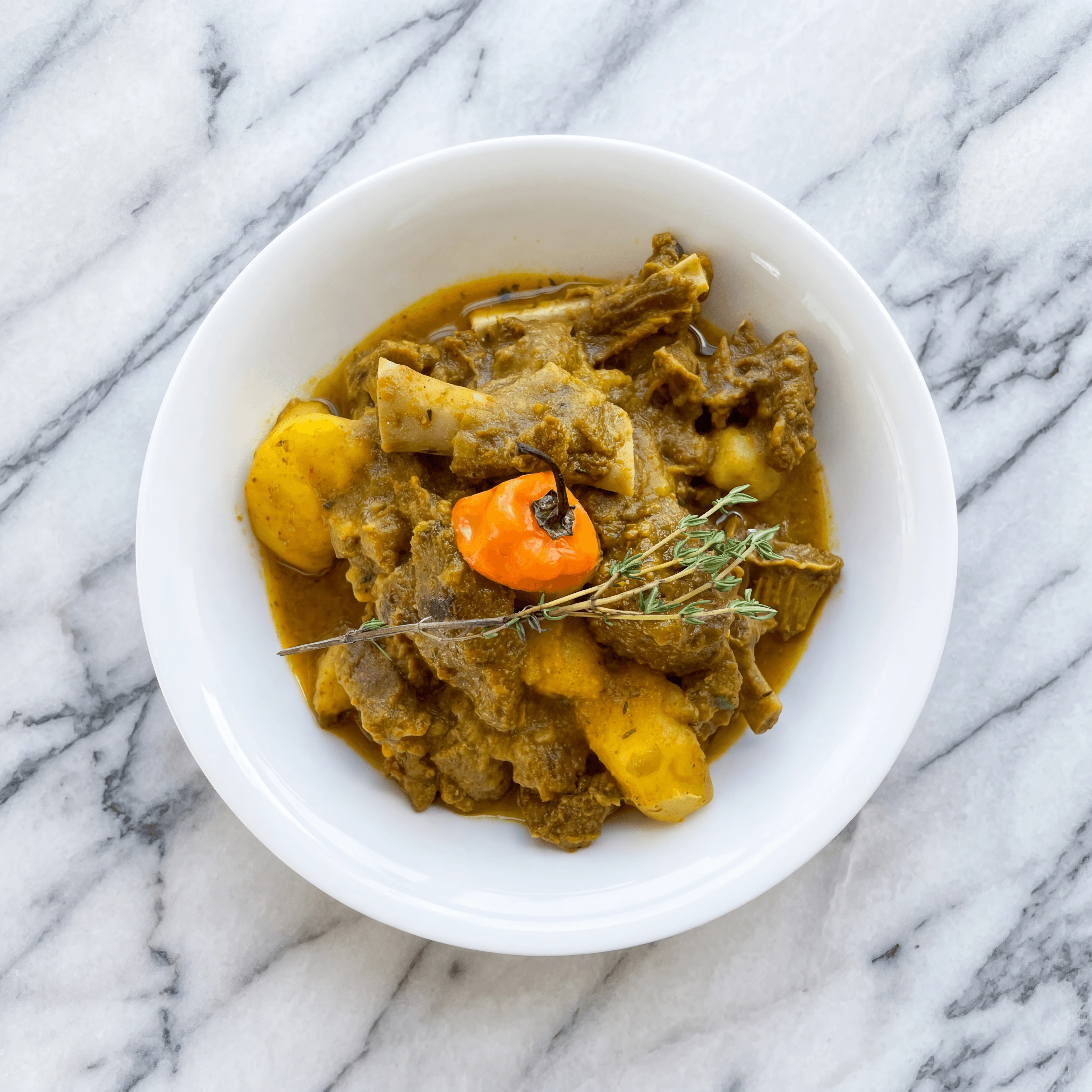 Curry goat rice and peas plantain Sunday dinner overhead jamaican — curry goat hero photography