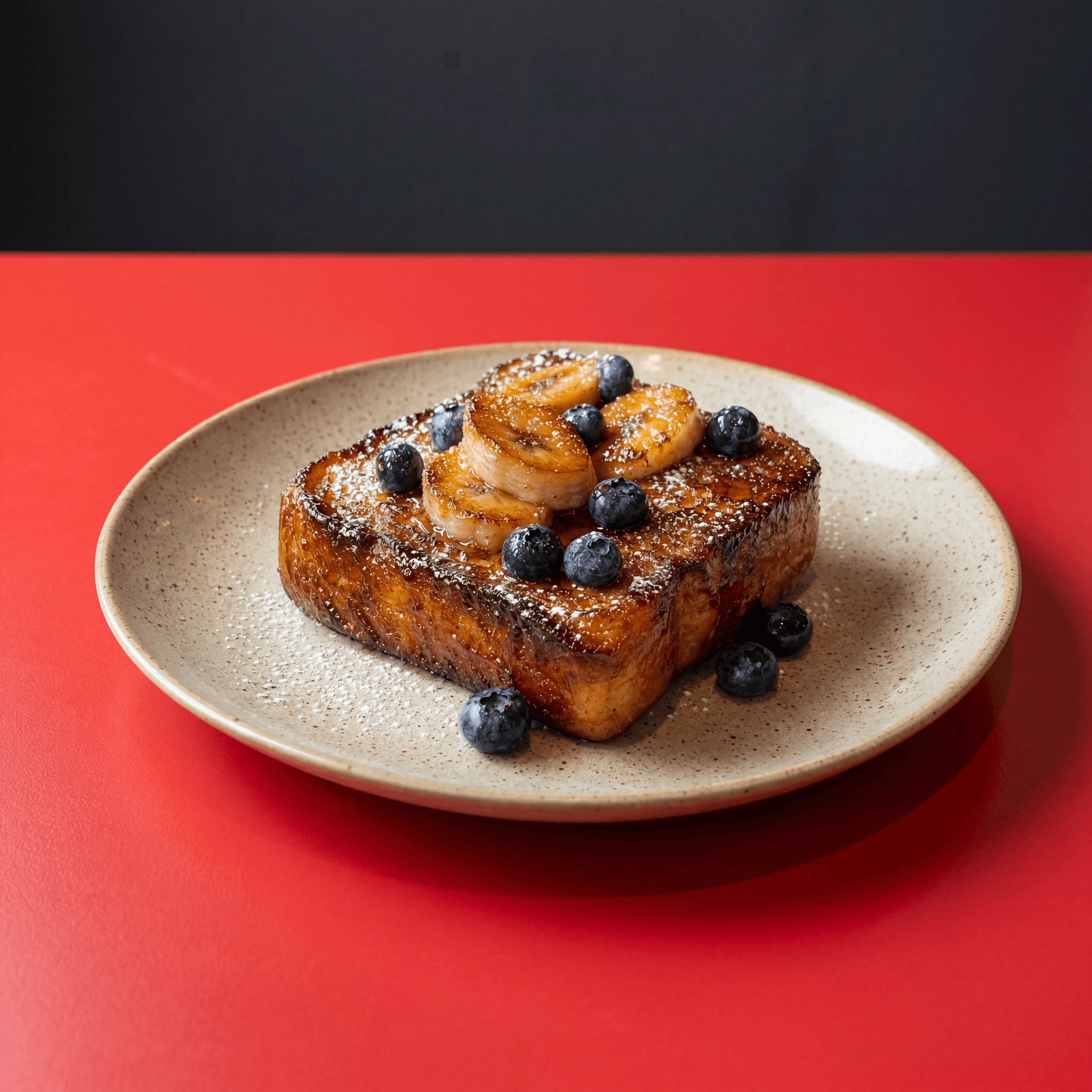 Thick-cut brioche French toast with caramelized banana and blueberries — brunch cafe photography