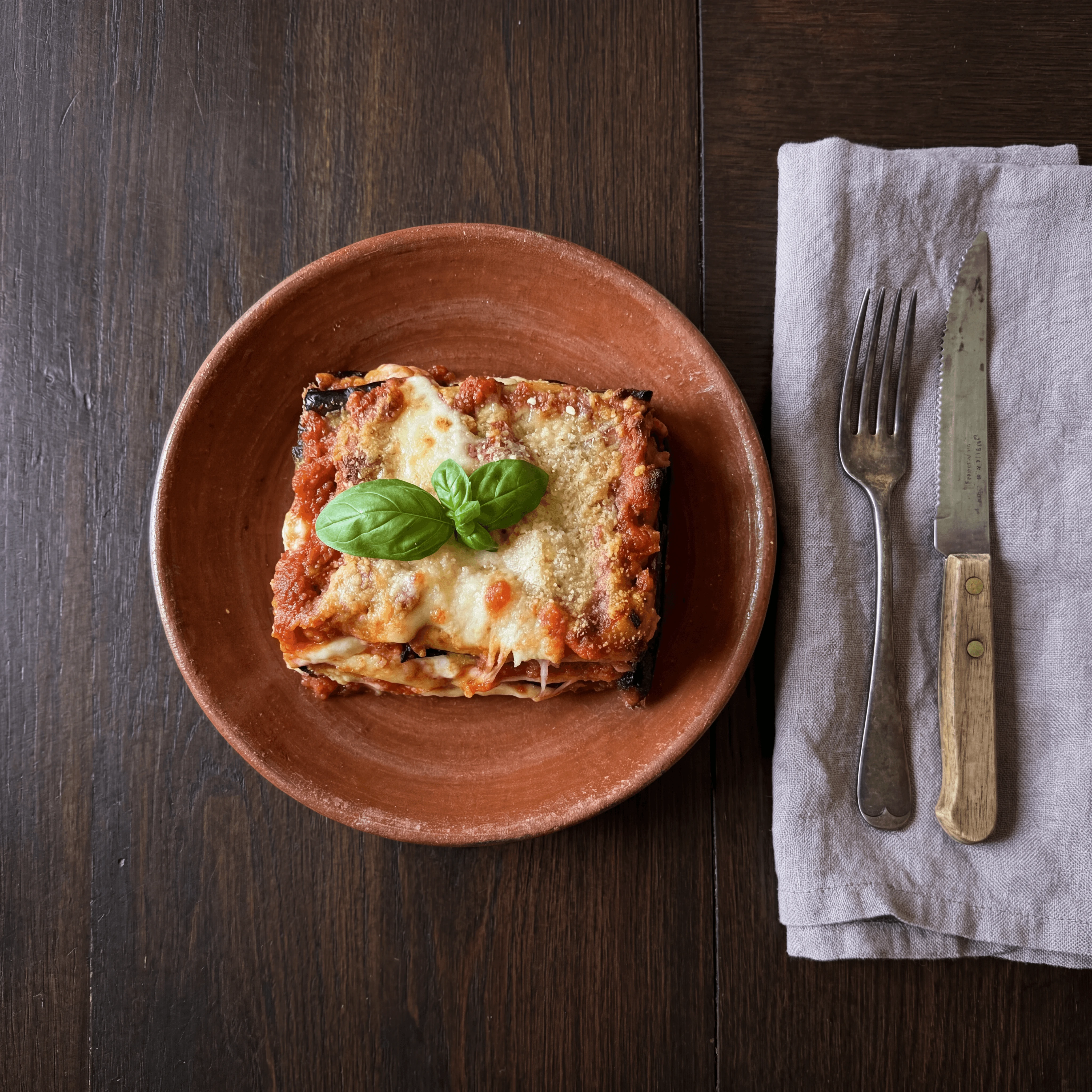 Eggplant lasagna parmigiana melanzane baked layers — Southern Italian pasta card photography