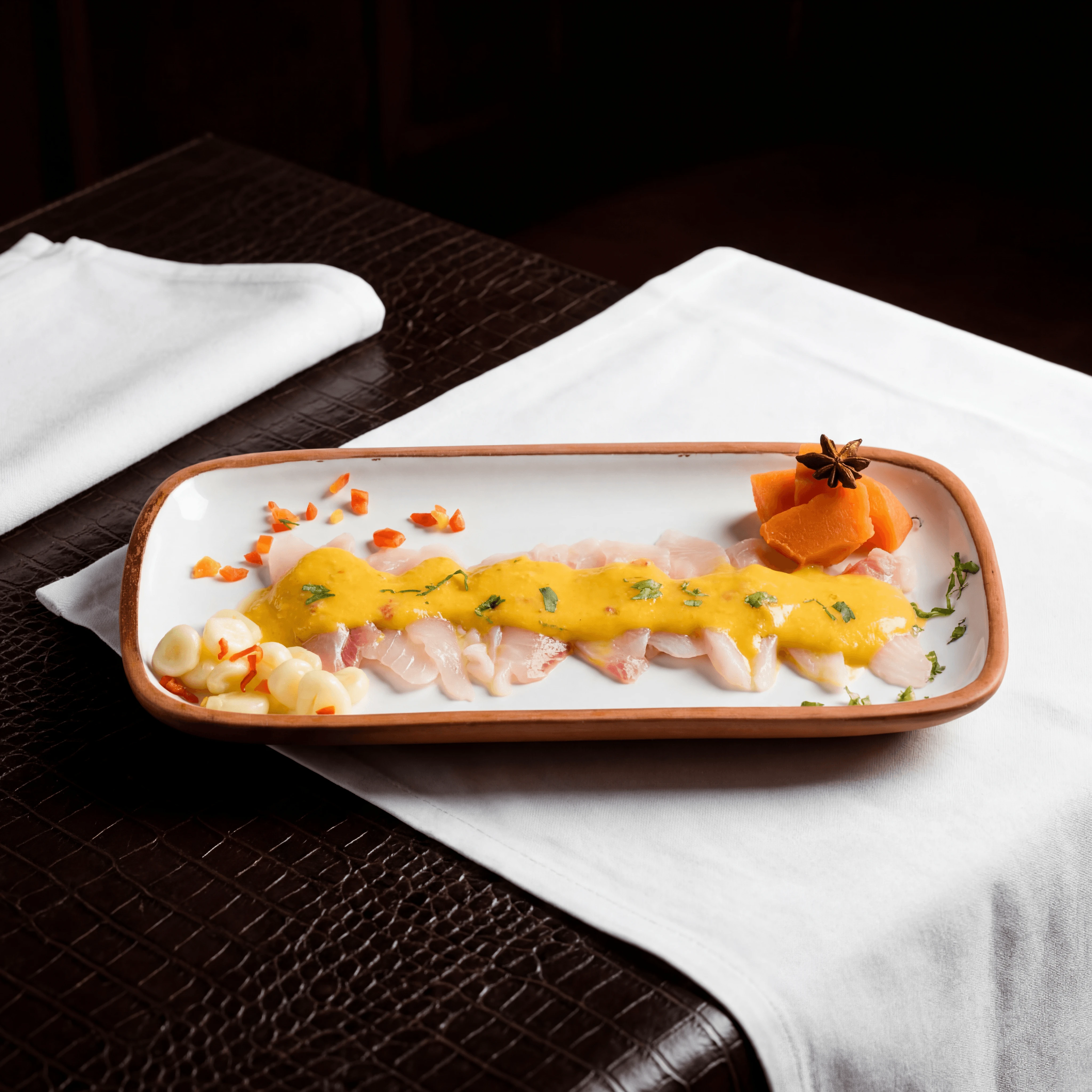 Nikkei tiradito sashimi style Peruvian Japanese fusion plate — nikkei tiradito hero photography