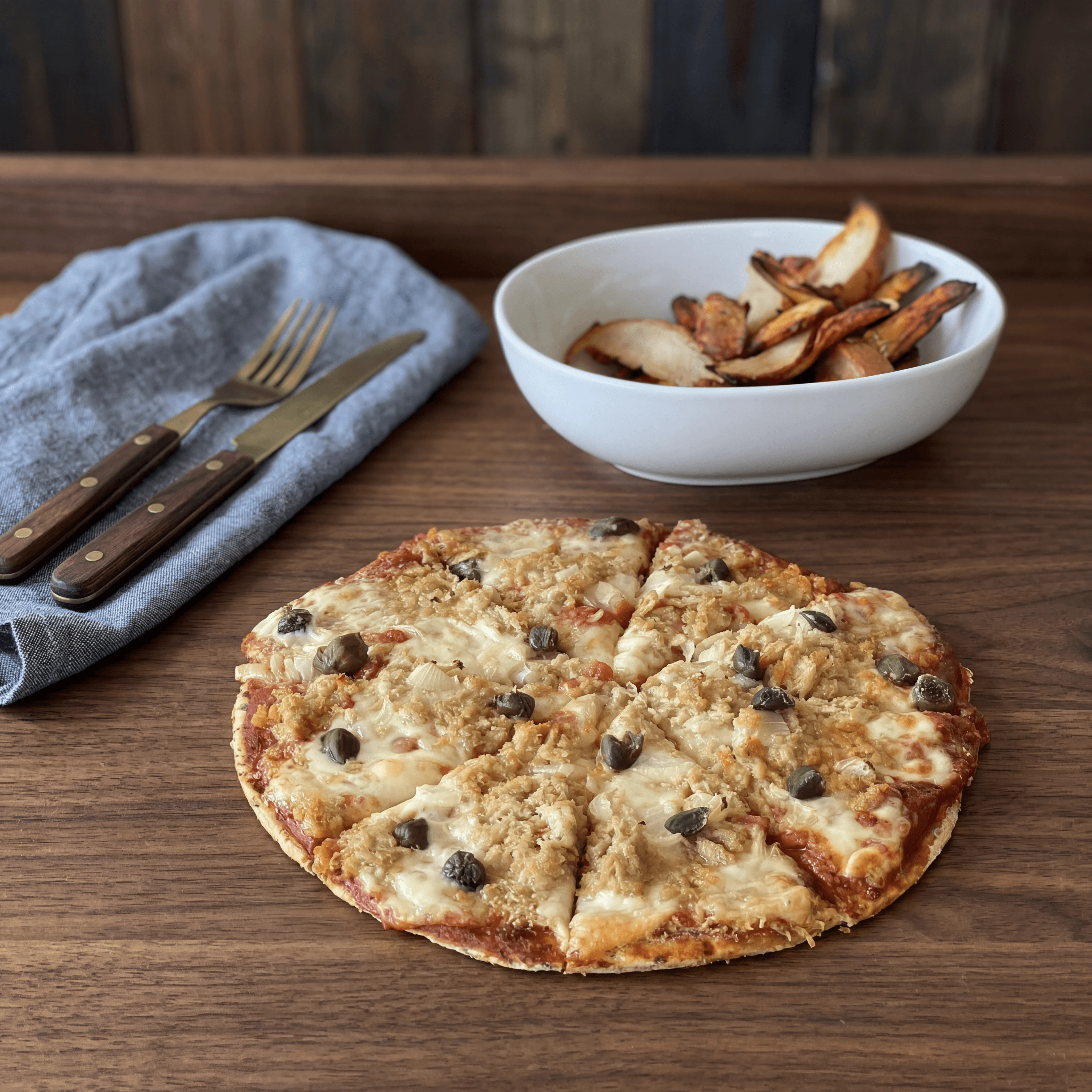 Brazilian house pizza with sautéed zucchini and Parmigiano on wooden board — pizzeria food photography