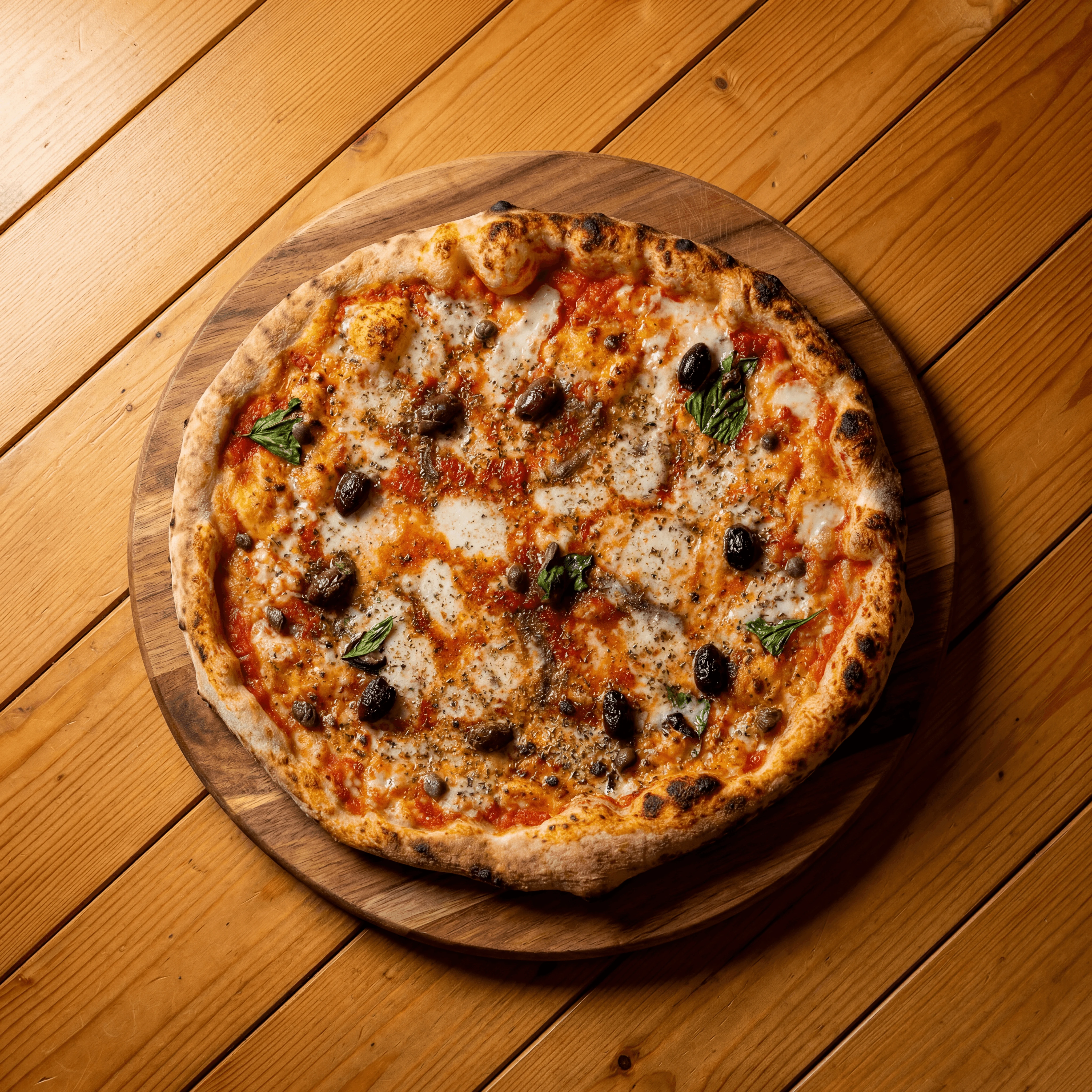 Wood-fired Margherita pizza with leopard-spotted charred crust and DOP mozzarella — Australian pizza photography