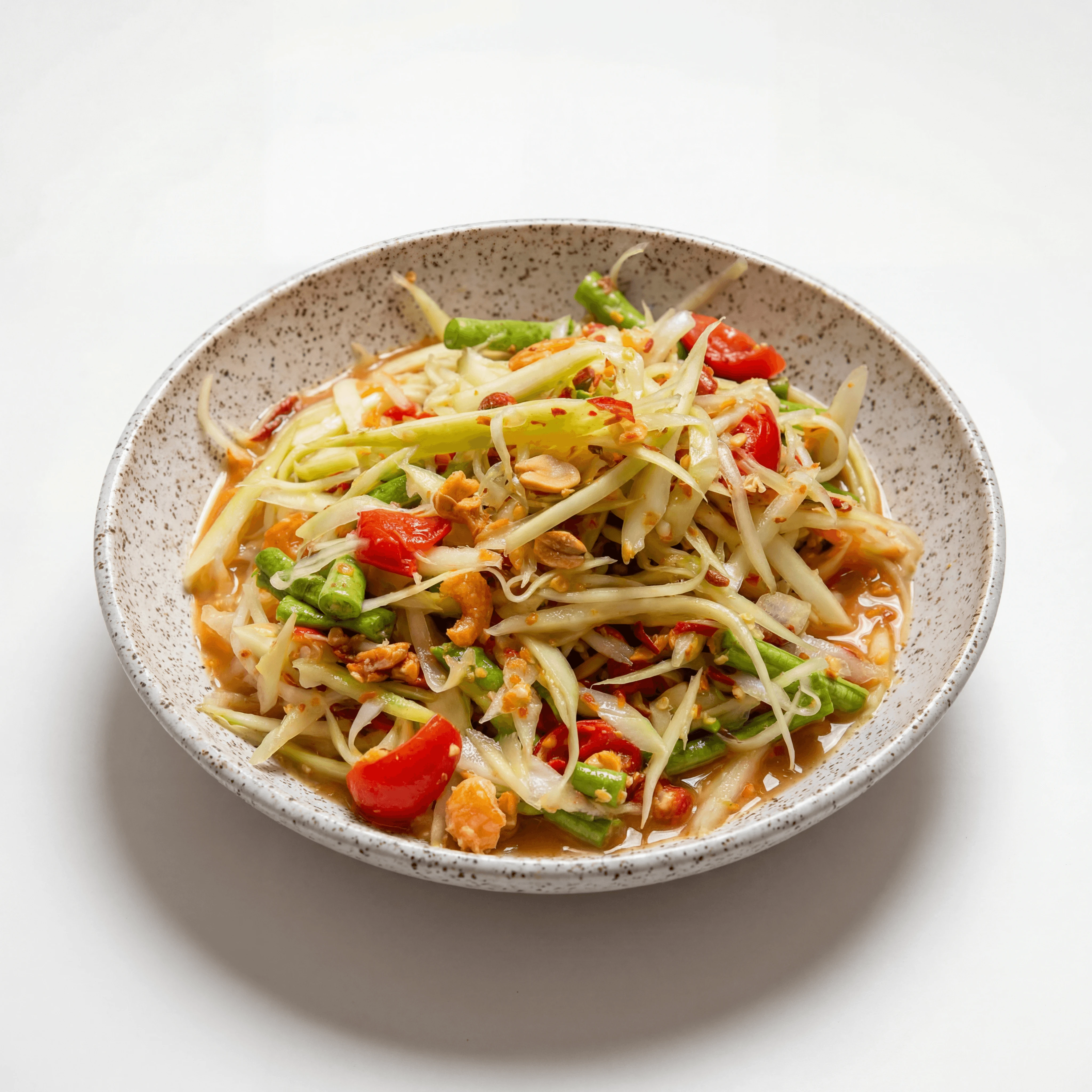 Som tam green papaya salad tomato peanut chili lime mortar plate — som tam hero photography